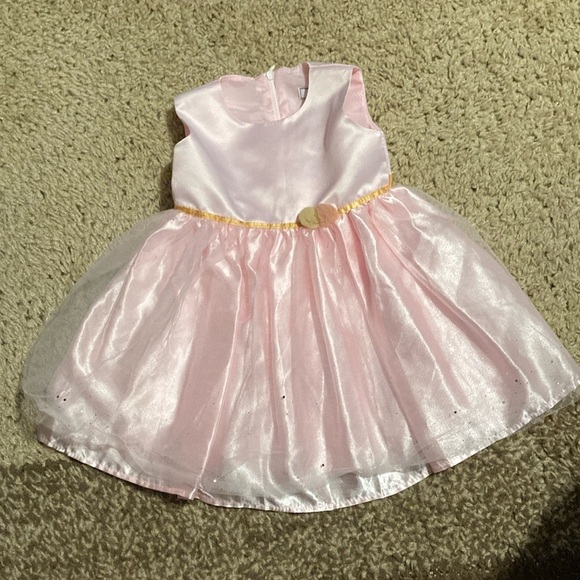 Dorissa sparkle tulle pink dress with a gold tie. - Picture 1 of 7